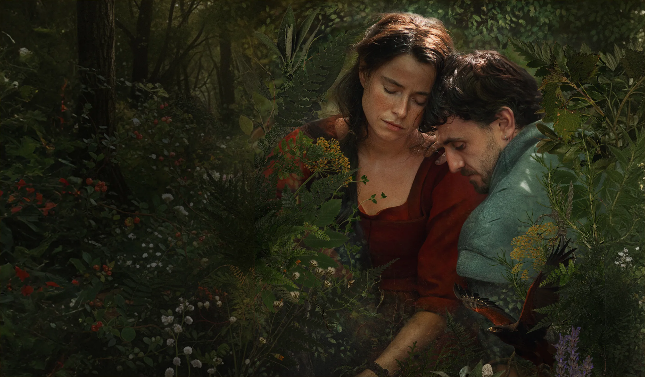 Two actors embracing against a leafy green background