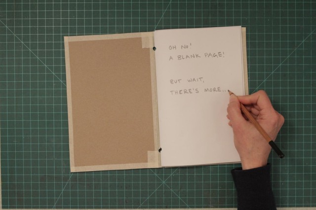 Showing a first page of the book that looks blank but says &quot;but wait, there is more!&quot;