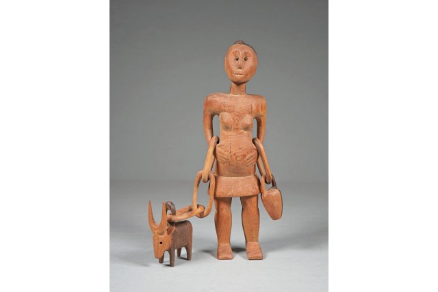Woman with Ox Figurine