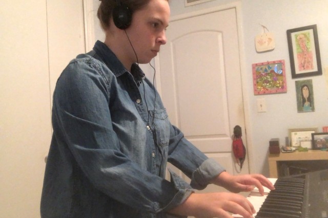Sam playing on keyboard