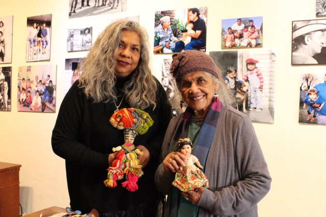 Rosanna and Ofelia Esparza with dolls