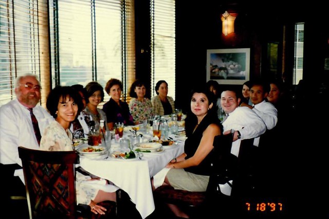 Marilyn Bello seated at head of table with Martha Garcia. Marilyn joined NHMLAC a year and four months before Martha, or as she likes to call her, &quot;Martita.&quot;