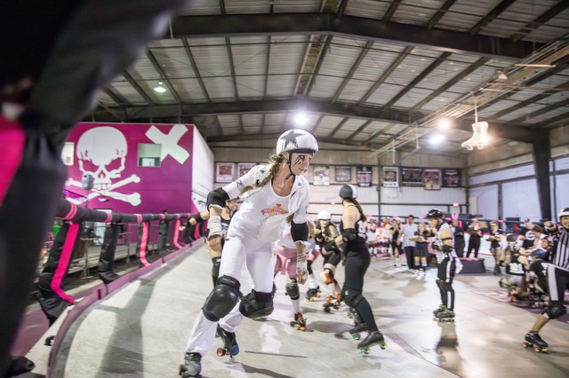 Evil E skating in a roller derby bout with LA Derby Dolls