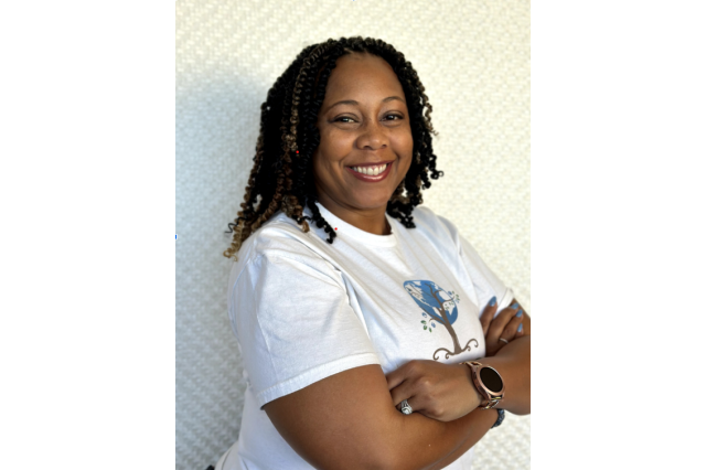 DeAnna Lee-Rivers wearing a t-shirt with arms crossed