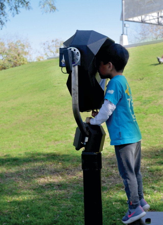 Kid looking through AR viewing tool