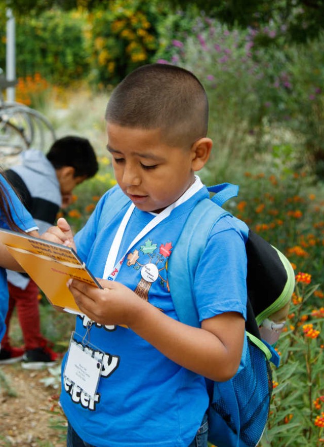 Kids doing a survey in the Nature Gardens. 