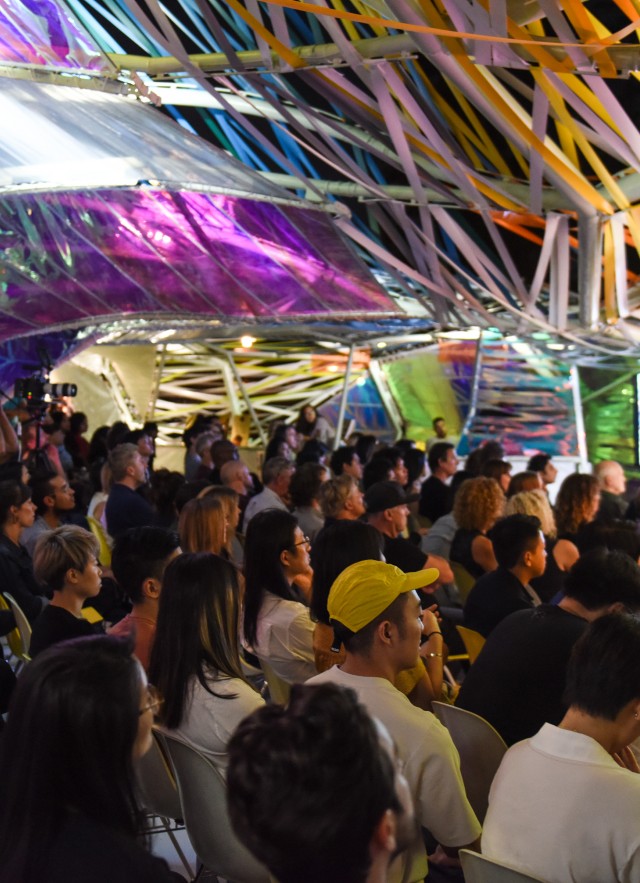 Guests seated inside Second Home Serpentine Pavilion