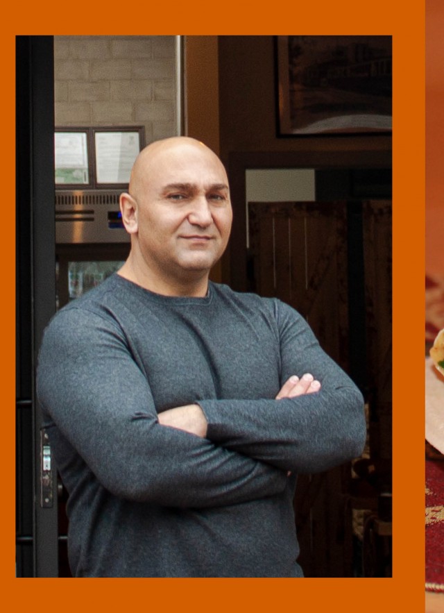 Man with crossed arms and bread on plate with herbs