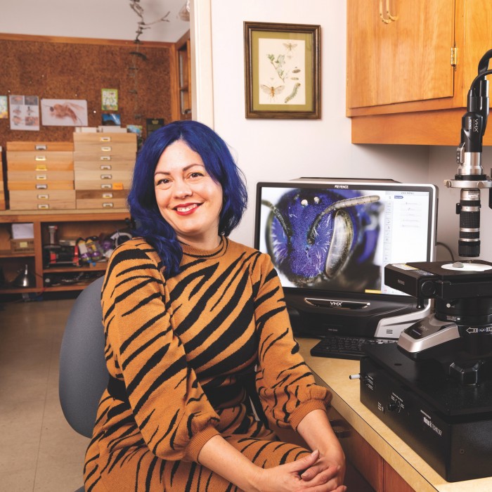 Lisa Gonzalez at her microscope