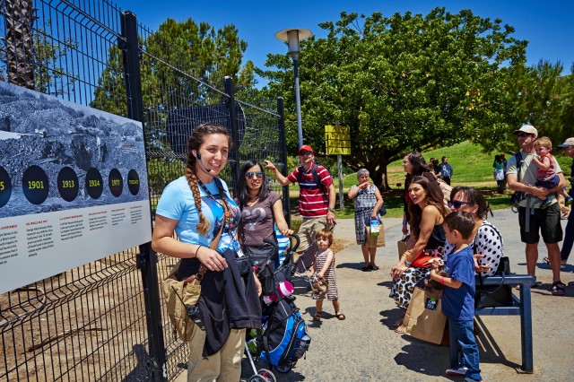 gallery interpreter with group tour outdoors at the Tar Pits