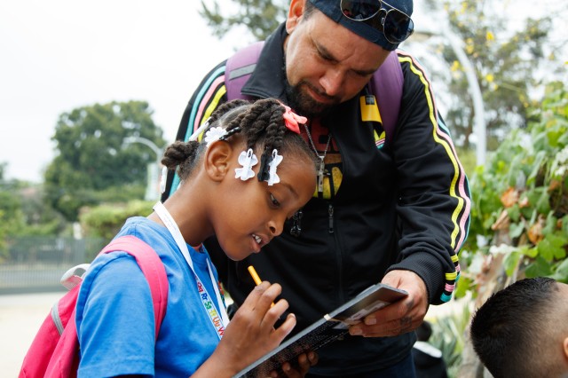 teacher and student in nature gardens field trip