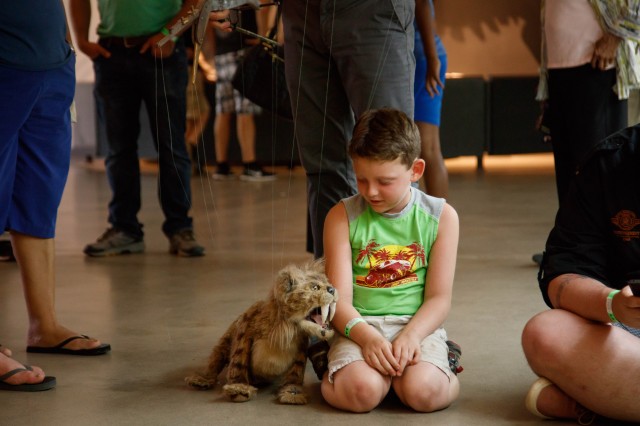 Nibbles, the small Saber-Toothed Cat puppet, at a Tar Pits Live Theater show