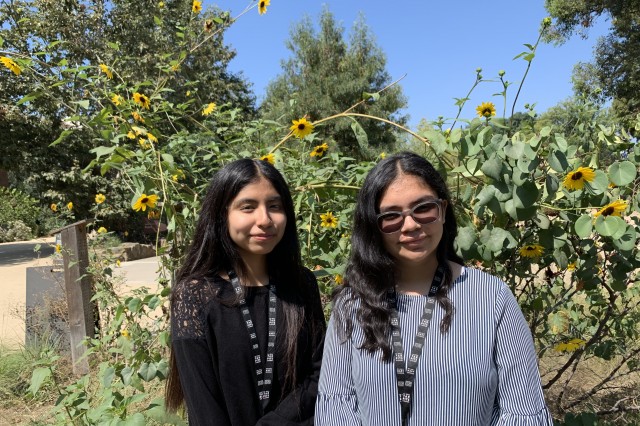 Melissa Nuñez and Maya Montelongo standing in the Nature Gardens