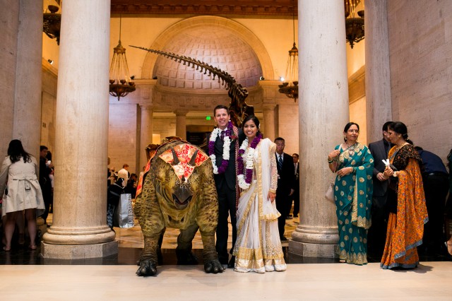 Bride and Groom pose with Triceratops puppet