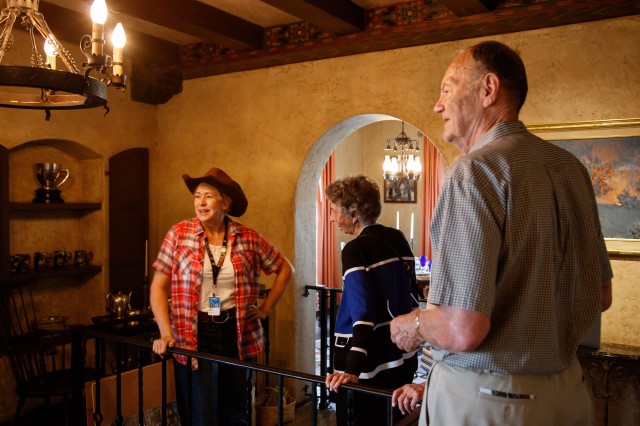 Hart museum visitors with tour guide inside Hart mansion