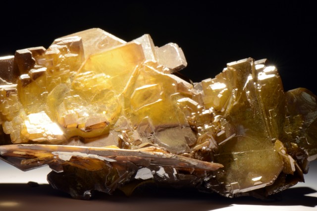 A light yellow and tan mineral with rectangular growths.