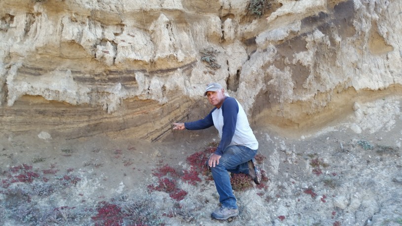 Alan points to a rock wall, where the remains of a 13,000 year old ancestor was found on Santa Rosa island.