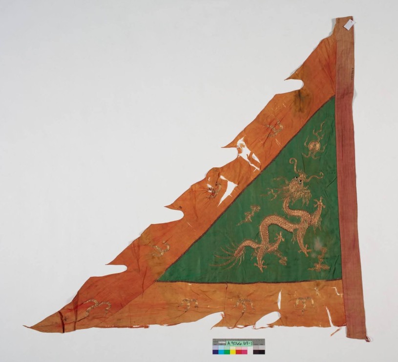 tattered old flag with dragon on it