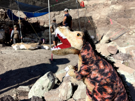 Hunter, the T. Rex Plushie at an dinosaur dig in utah